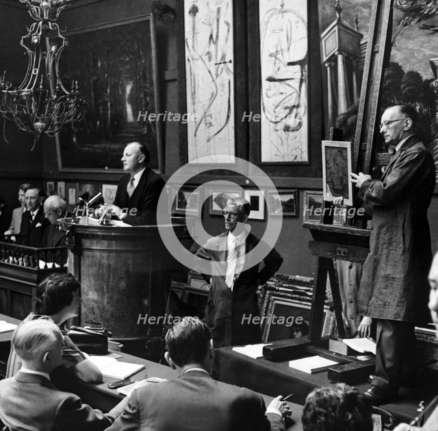 Auction at Sotheby's, London, 1961. Creator: Henry Grant.