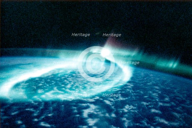 Aurora Borealis (Northern Lights) viewed from space. Creator: Unknown.