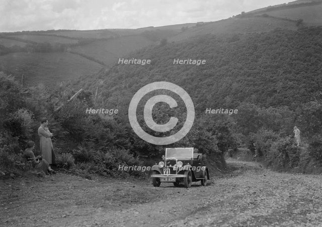 Austin 10 competing in the Mid Surrey AC Barnstaple Trial, Beggars Roost, Devon, 1934. Artist: Bill Brunell.