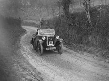 Austin 7 arrow-bodied 2-seater of JS Drewett competing in the NWLMC London-Gloucester Trial, 1931. Artist: Bill Brunell