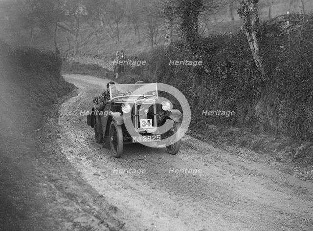 Austin 7 arrow-bodied 2-seater of JS Drewett competing in the NWLMC London-Gloucester Trial, 1931. Artist: Bill Brunell.