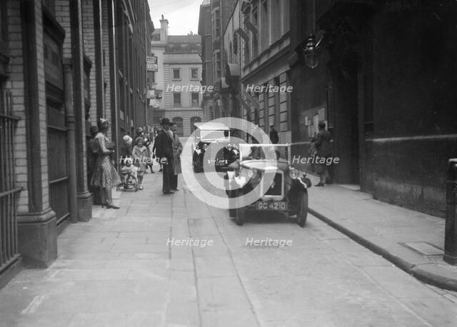 Austin 7 at a motor vehicle blessing ceremony. Artist: Bill Brunell.