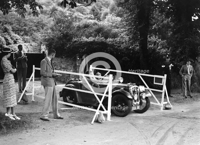 Austin 7 of CD Buckley, winner of a premier award at the MCC Torquay Rally, July 1937. Artist: Bill Brunell.