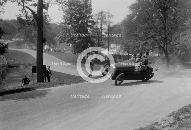 Austin 7 of B Sparrow about to crash, Donington Park Race Meeting, Leicestershire, 1933. Artist: Bill Brunell.