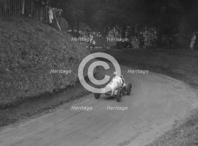 Austin 7 of LP Driscoll competing in the MAC Shelsley Walsh Speed Hill Climb, Worcestershire, 1935. Artist: Bill Brunell.
