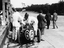 Austin by the pit wall, 500 Mile Race, Brooklands, Surrey, (1931?)