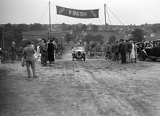Austin Swallow of Mrs A Stanley at the finish of the Middlesex County AC Hill Climb, c1930. Artist: Bill Brunell