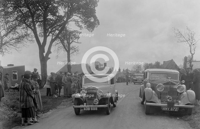 Austin sports saloon of Mrs MS Flewitt and Rolls-Royce saloon at the RSAC Scottish Rally, 1934. Artist: Bill Brunell.