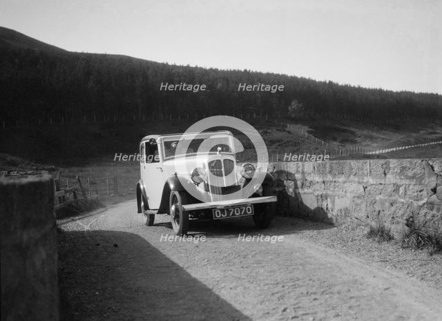 Austin Ten-Four 2-door saloon of JA Flewitt competing in the RSAC Scottish Rally, 1933. Artist: Bill Brunell.