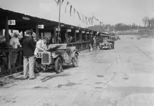 Austin Ulster and MG C type in the pits at the JCC Double Twelve race, Brooklands, 8/9 May 1931. Artist: Bill Brunell