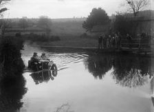 Austin Ulster driving through a ford during a motoring trial, 1936. Artist: Bill Brunell