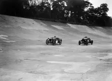 Austin Ulster leading a Windsor on the banking at Brooklands. Artist: Bill Brunell