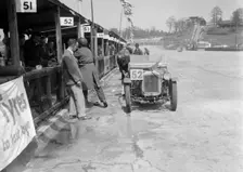 Austin Ulster of ECH Randall and WE Harker in the pits, JCC Double Twelve race, Brooklands, 1931. Artist: Bill Brunell