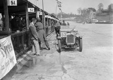 Austin Ulster of ECH Randall and WE Harker in the pits, JCC Double Twelve race, Brooklands, 1931. Artist: Bill Brunell