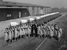 Australian sales girls in front of a fleet of 1965 Hillman Imps, Selby, North Yorkshire, 1965. Creator: Michael Walters