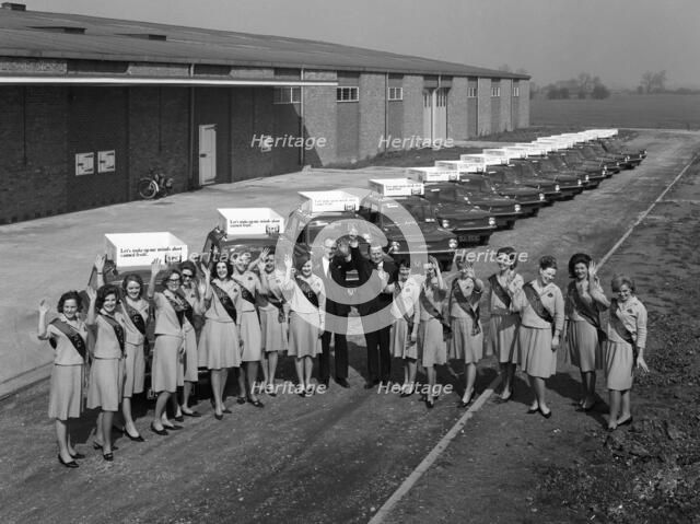 Australian sales girls in front of a fleet of 1965 Hillman Imps, Selby, North Yorkshire, 1965. Artist: Michael Walters