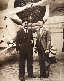 Aviators Wiley Post and Harold Gatty in front of Winnie Mae New York, USA, 1931. Creator: S and G