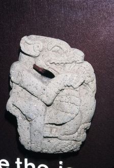 Aztec stone carving of Jaguar killing a Vulture, Hacha, Veracruz state: Mexico, 400-700