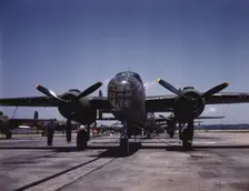 B-25 bombers on the outdoor assembly line at North American Aviation..., Kansas City, Kansas, 1942. Creator: Alfred T Palmer