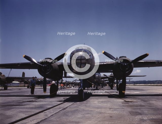 B-25 bombers on the outdoor assembly line at North American Aviation..., Kansas City, Kansas, 1942. Creator: Alfred T Palmer.