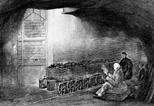 Bottom of a pit shaft in a coal mine with a train of loaded wagons, 1860. Creator: Unknown