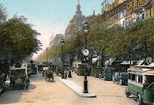 Boulevard des Italiens, Paris, with cars and motor buses on the street, c1900. Creator: Unknown