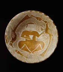 Bowl depicting a Man holding a Cup and a Flowering Branch, Iraq, 10th century. Creator: Unknown