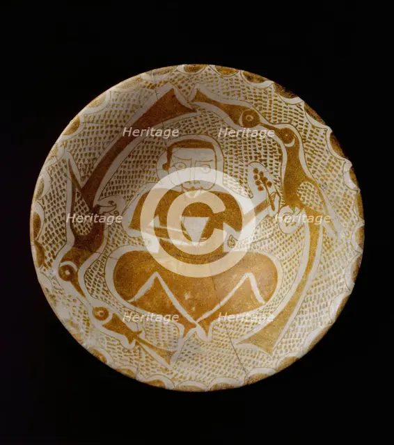 Bowl depicting a Man holding a Cup and a Flowering Branch, Iraq, 10th century. Creator: Unknown.