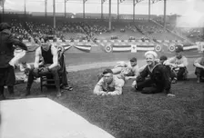 Boxer Joe Welling, amid Cleveland baseball players in stadium, 1918. Creator: Bain News Service