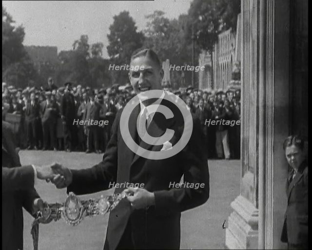 Boxer, Jack Petersen Accepting a Boxing Award Belt, 1930s. Creator: British Pathe Ltd.