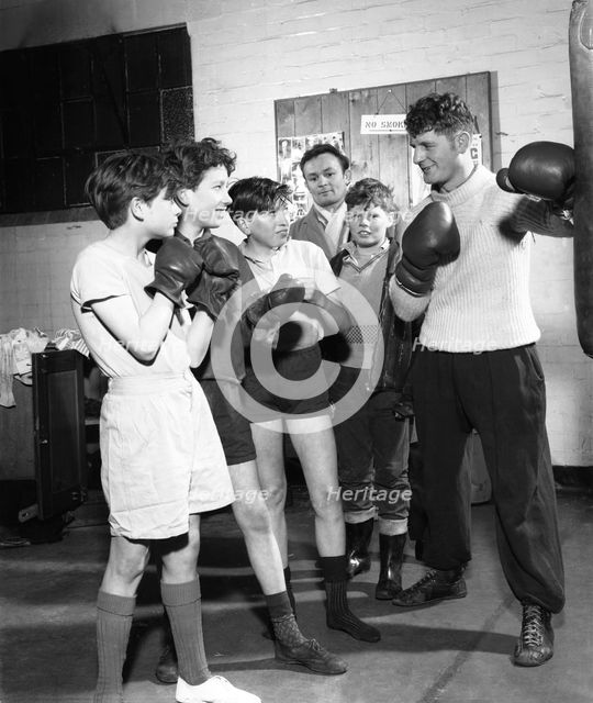 Boxing training at Horden Colliery gym, Sunderland, Tyne and Wear, 1964.  Artist: Michael Walters
