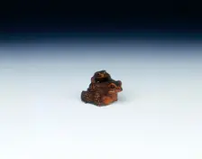 Boxwood netsuke of toad with young, signed by Masanao, Japan, early 19th century. Creator: Suzuki Masanao