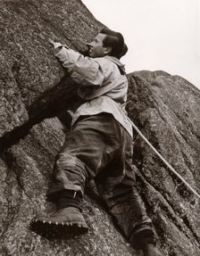 Boy climbing rock face, Outward Bound School, Eskdale, Cumbria,1950