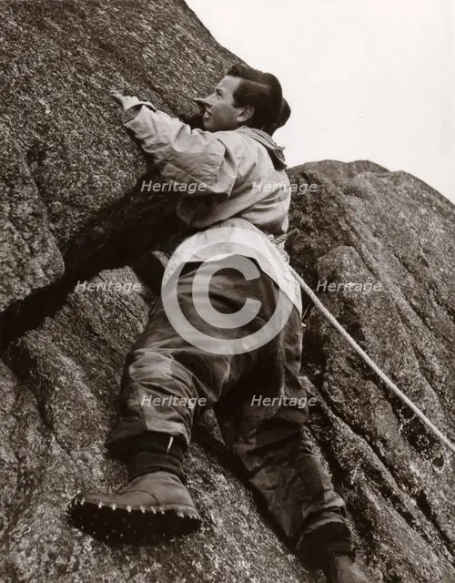 Boy climbing rock face, Outward Bound School, Eskdale, Cumbria,1950. Artist: Unknown