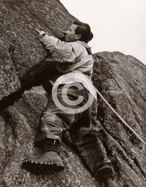 Boy climbing rock face, Outward Bound School, Eskdale, Cumbria,1950. Artist: Unknown