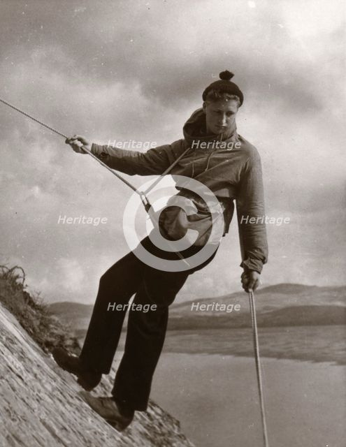 Boy descending rock face, Outward Bound School, Eskdale, Cumbria,1950. Artist: Unknown