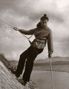 Boy descending rock face, Outward Bound School, Eskdale, Cumbria,1950