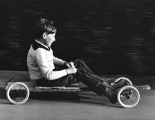 Boy driving a home-made go-kart, Horley, Surrey, 1965