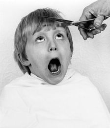 Boy having a haircut, 1988