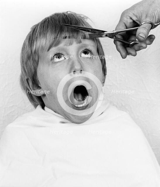 Boy having a haircut, 1988.