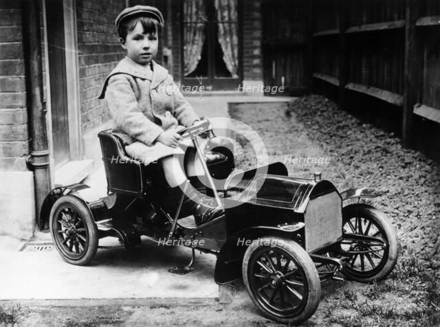 Boy in 1908 Mercedes 28/32 hp pedal car, c1908. Artist: Unknown