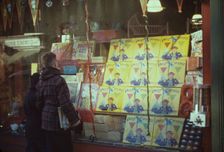 Boy looking at store window display of toys, between 1941 and 1942. Creator: Unknown