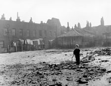 Boy playing on sewage works, East End, London, c1951. Creator: Henry Grant