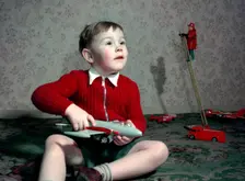 Boy playing with a toy aeroplane, c1960s. Creator: Arthur Charles Kirby Ware
