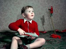 Boy playing with a toy aeroplane, c1960s. Creator: Arthur Charles Kirby Ware