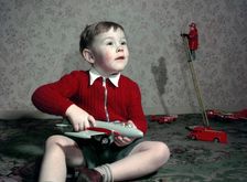 Boy playing with a toy aeroplane, c1960s. Creator: Arthur Charles Kirby Ware