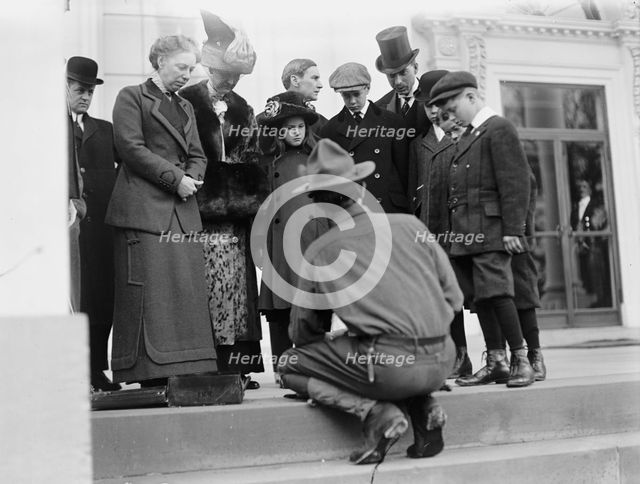 Boy Scouts - Visit of Sir Robert Baden-Powell To D.C. Making Fire; Mrs. Taft Watching, 1911. Creator: Harris & Ewing.