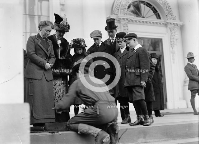 Boy Scouts - Visit of Sir Robert Baden-Powell To D.C. Making Fire; Mrs. Taft Watching, 1911. Creator: Harris & Ewing.
