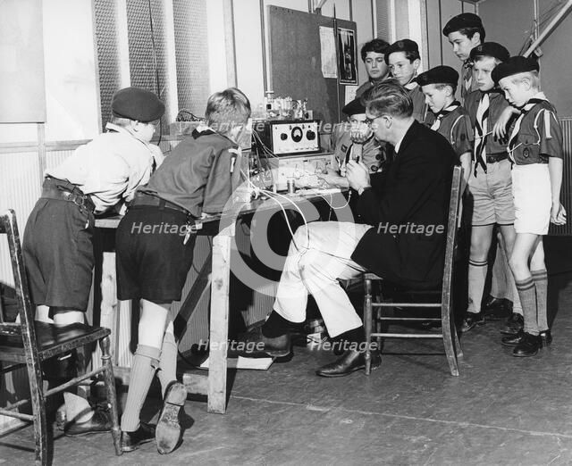 Boy scouts learning radio transmitting, 1960s.