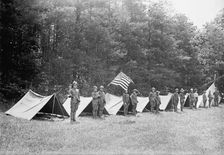 Boy Scouts Standing In Front of Tents In Encampment, between 1914 and 1917. Creator: Harris & Ewing